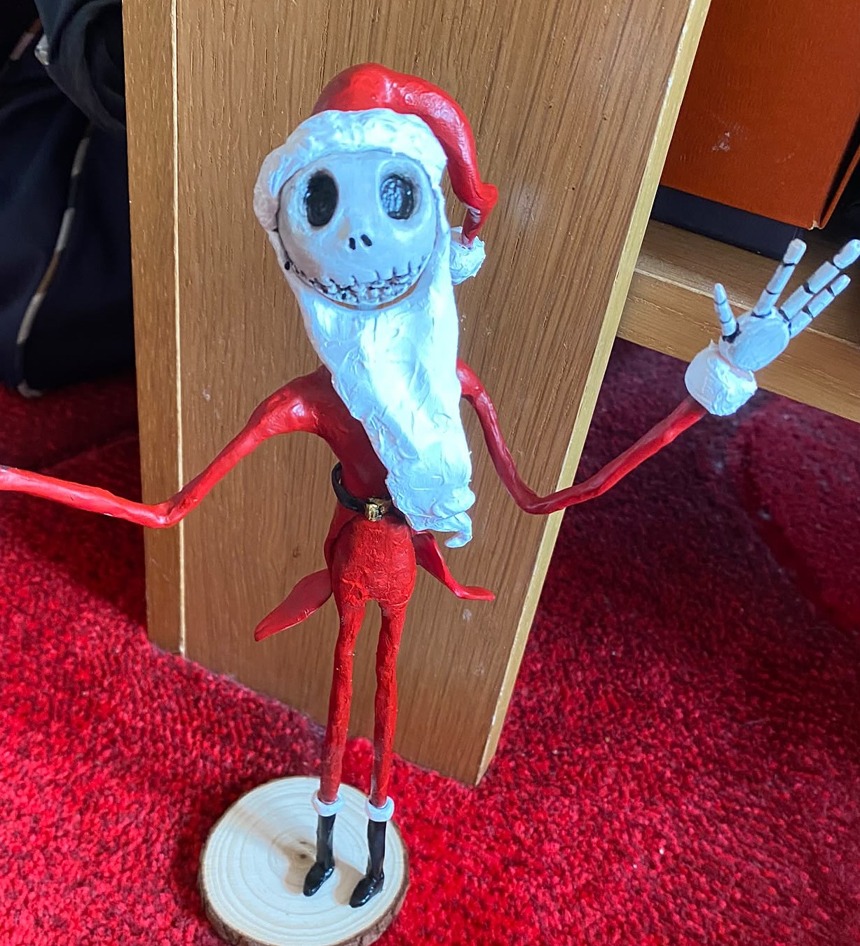 Hand-sculpted figure of Jack Skellington in a Santa suit