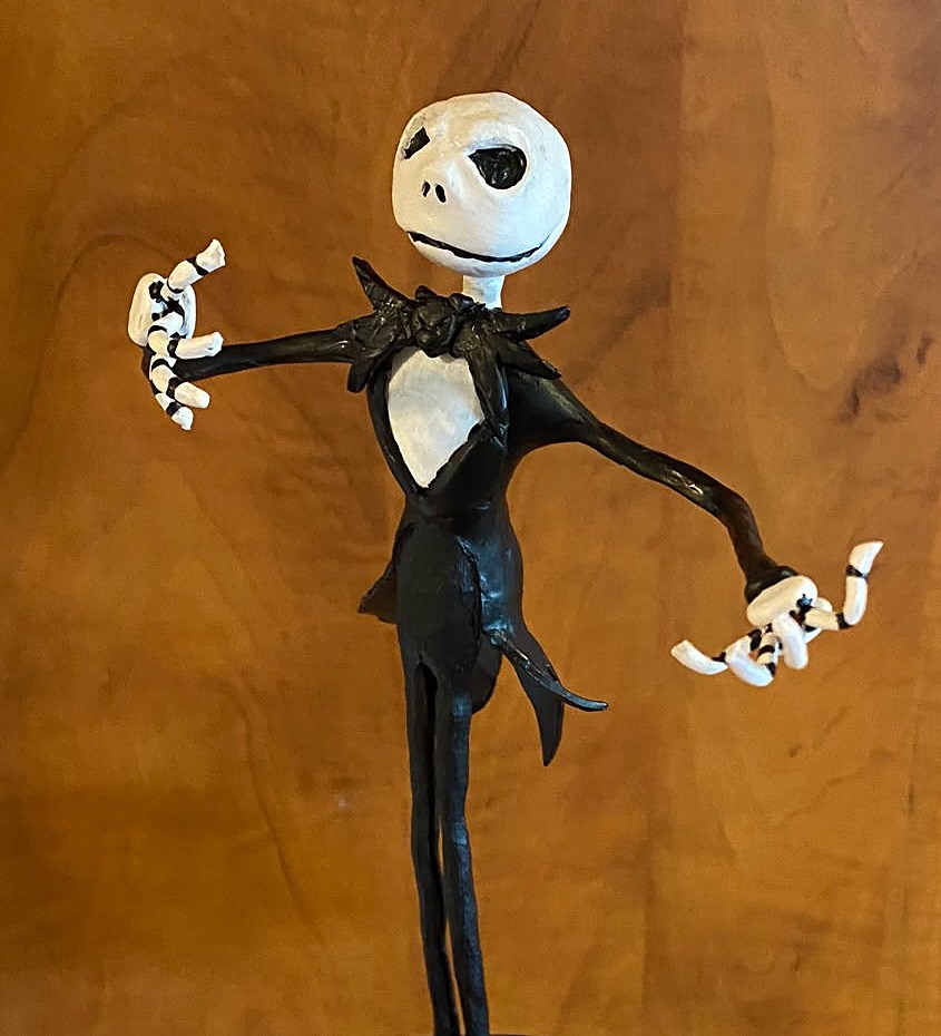 Hand-sculpted figure of Jack Skellington on a purple base