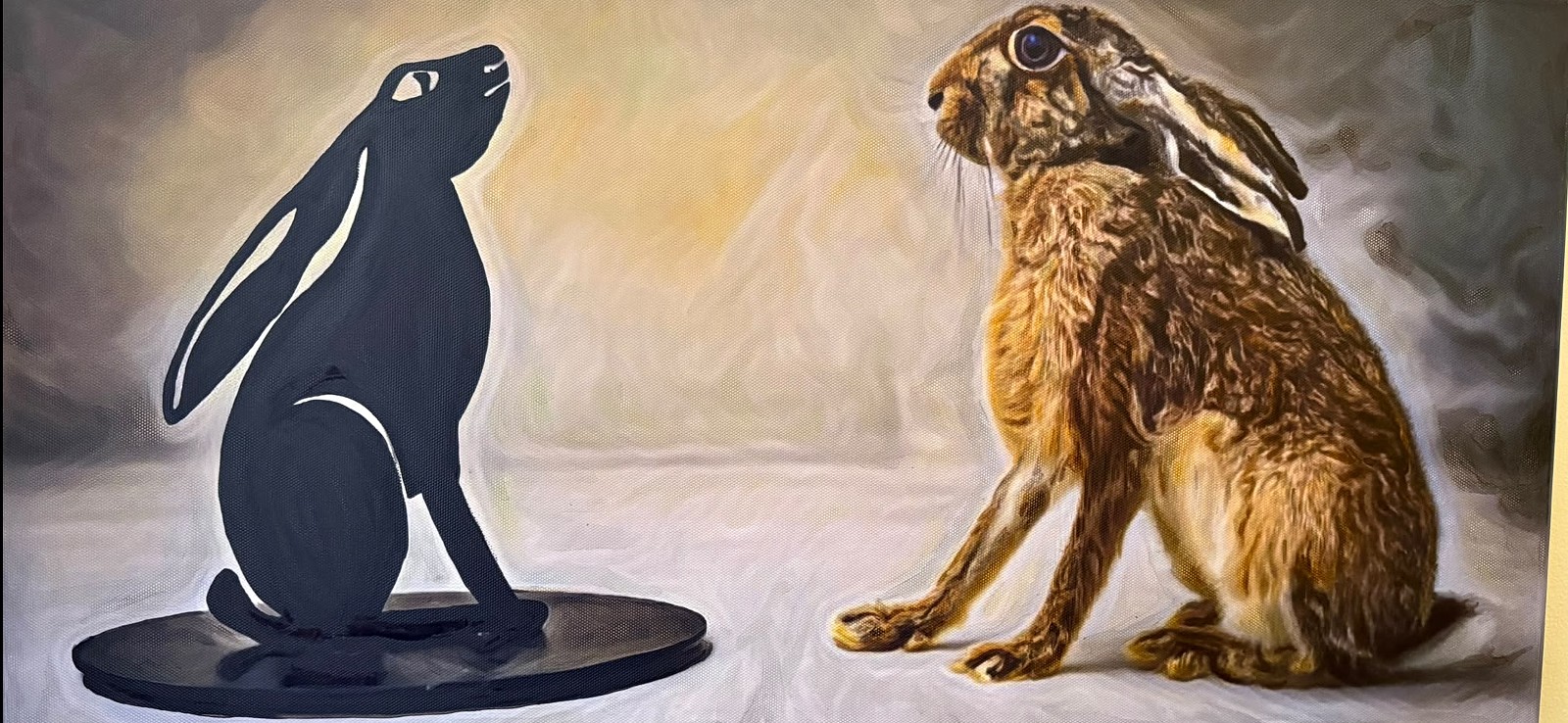 Hare oil painting alongside a moon-gazing hare sculpture
